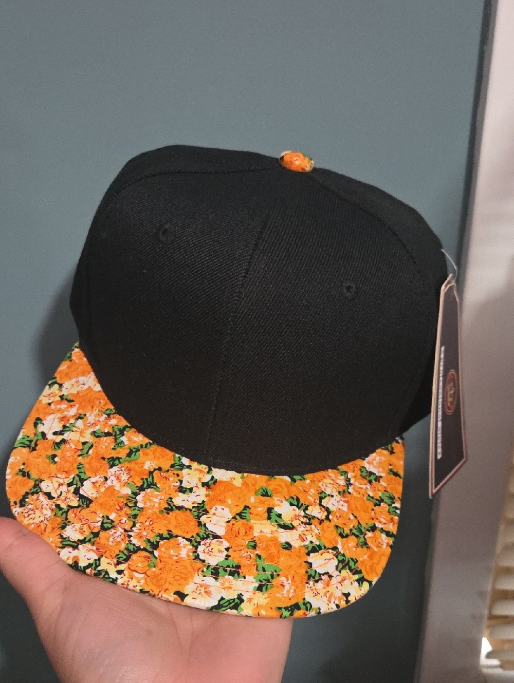 Black Snapback Cap with Orange Floral Brim